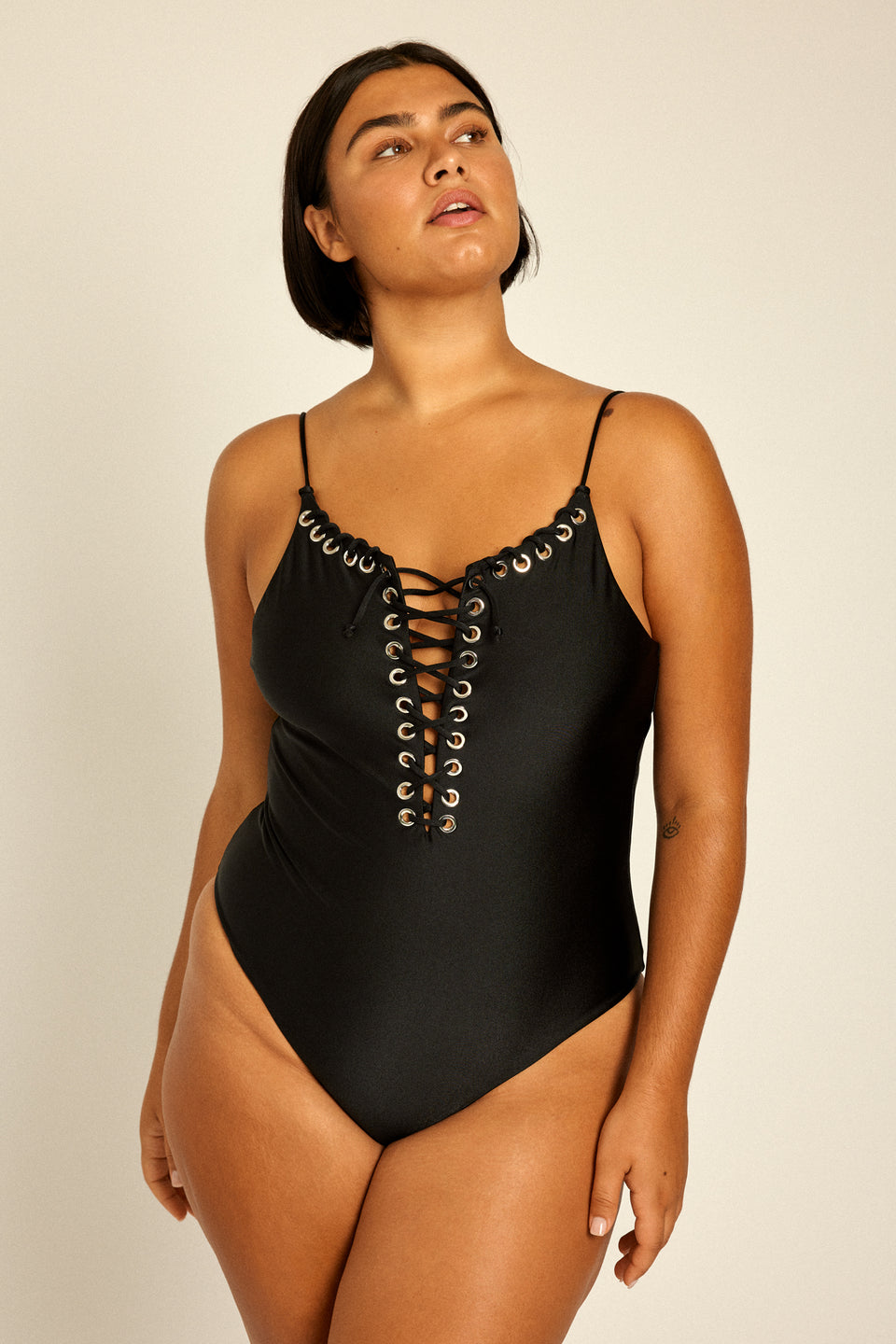 Beautiful curvy model in plus size XL Eyelet Swimsuit for summer beach & vacation.