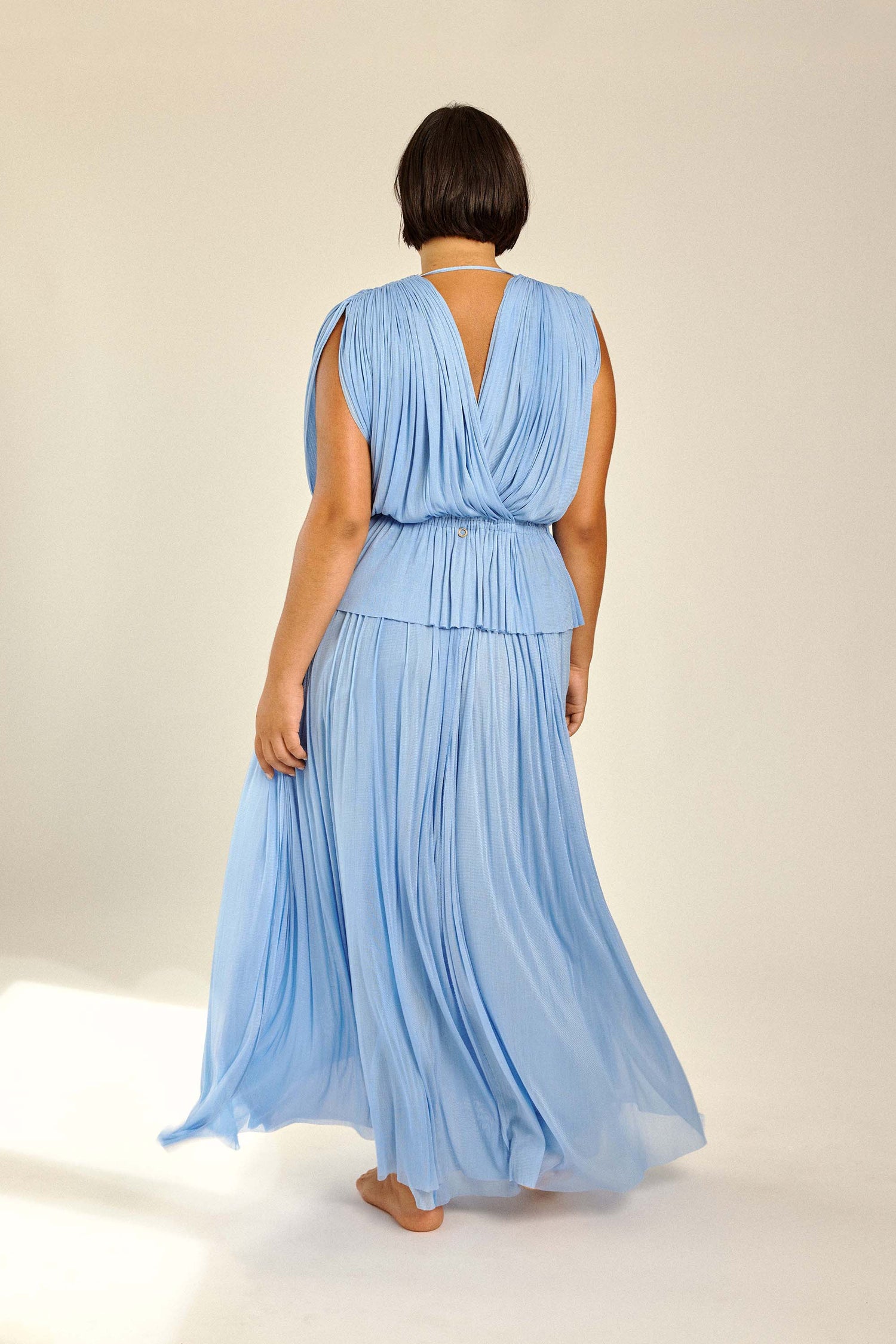 Beautiful woman in silk Top for resort, party & wedding.